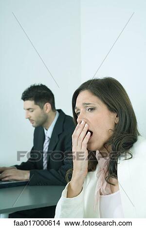 Businesswoman yawning View Large Photo Image Picture - Businesswoman yawning. Fotosearch