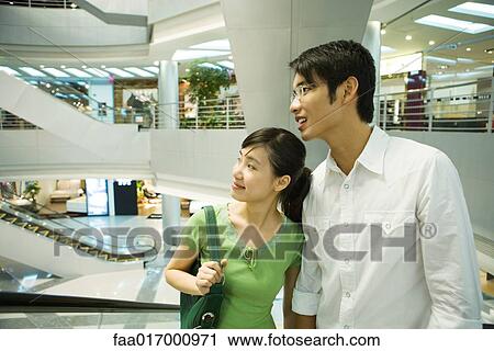 Couple in shopping mall View Large Photo Image Stock Image - Couple in shopping mall. Fotosearch