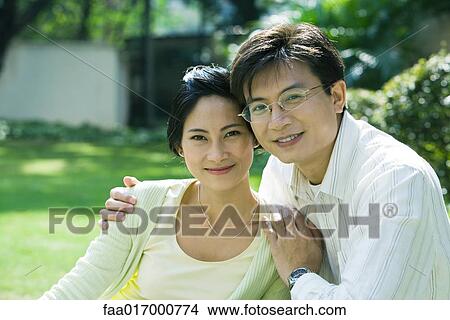 Couple, smiling at camera, portrait View Large Photo Image Picture - Couple, smiling at camera, portrait. Fotosearch