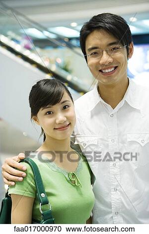 Couple smiling at camera, portrait View Large Photo Image Stock Image - Couple smiling at camera, portrait. Fotosearch