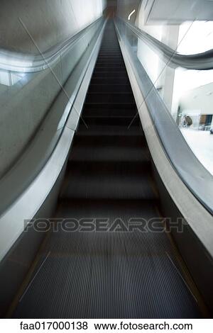 Stock Photo - Escalator, low angle view. Fotosearch