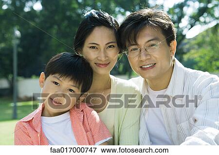 Stock Photo - Family, smiling at camera, portrait. Fotosearch