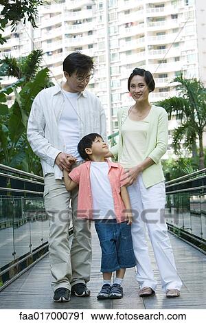 Family standing on walkway, portrait View Large Photo Image Stock Image - Family standing on walkway, portrait. Fotosearch