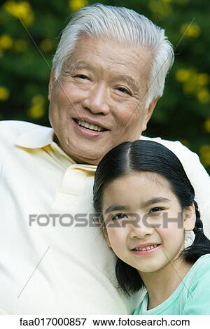 Stock Photo - Girl with grandfather, portrait. Fotosearch