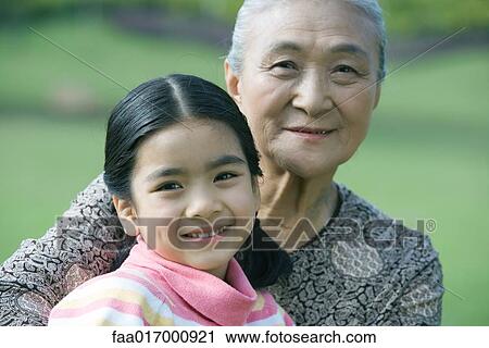 Stock Image - Girl with grandmother, portrait. Fotosearch