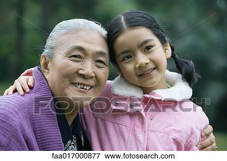 Stock Photo - Girl with grandmother, portrait. Fotosearch