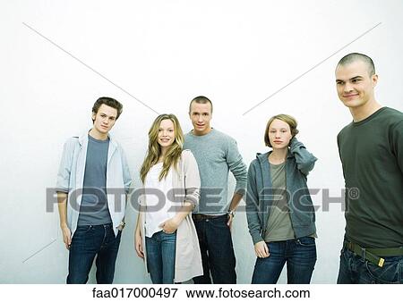 Group of young adult and teenage friends, white background View Large Photo Image Stock Photo - Group of young adult and teenage friends, white background. Fotosearch