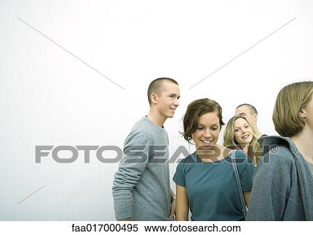 Stock Photography - Group of young adult and teenage friends, white background. Fotosearch