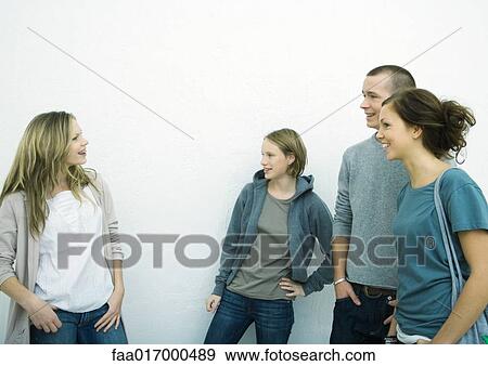 Stock Photo - Group of young friends, side view. Fotosearch