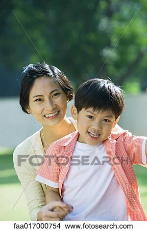 Picture - Mother and son, portrait, smiling at camera. Fotosearch