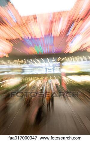 Stock Photo - Neon lights at night, blurred motion. Fotosearch