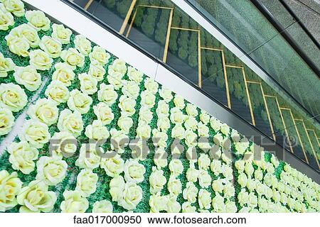 Stock Image - Rose decoration and escalator. Fotosearch