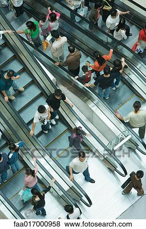 Stock Photo - Shopping mall escalators, high angle view. Fotosearch