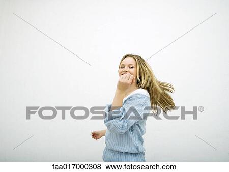 Stock Photo - Teenage girl dancing, portrait. Fotosearch