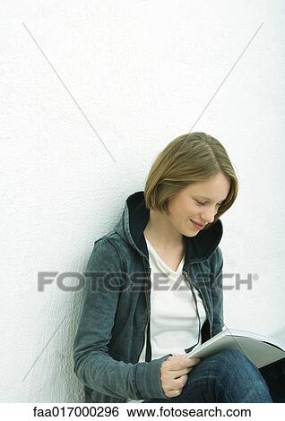 Teenage girl reading, portrait View Large Photo Image Stock Photograph - Teenage girl reading, portrait. Fotosearch