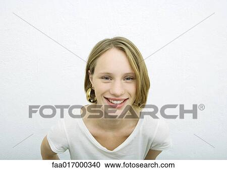 Teenage girl smiling at camera View Large Photo Image Stock Image - Teenage girl smiling at camera. Fotosearch