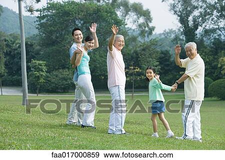 Three generation family waving at camera View Large Photo Image Stock Photo - Three generation family waving at camera. Fotosearch