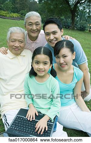 Three generation family with laptop, portrait View Large Photo Image Picture - Three generation family with laptop, portrait. Fotosearch