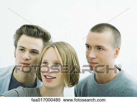 Three young friends, looking out of frame View Large Photo Image Stock Photography - Three young friends, looking out of frame. Fotosearch