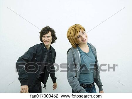 Two young adults, dancing, white background View Large Photo Image Stock Image - Two young adults, dancing, white background. Fotosearch