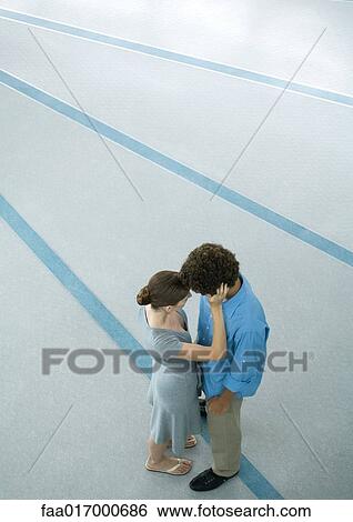 Young couple embracing, full length, high angle view View Large Photo Image Stock Photograph - Young couple embracing, full length, high angle view. Fotosearch