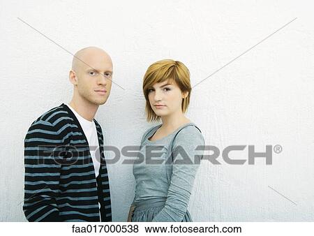 Young couple, looking at camera, portrait, white background View Large Photo Image Stock Photo - Young couple, looking at camera, portrait, white background. Fotosearch