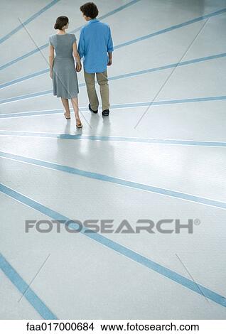 Picture - Young couple, rear view, full length. Fotosearch