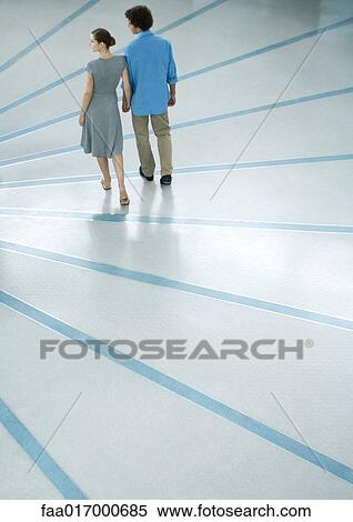 Young couple, rear view, full length View Large Photo Image Stock Photography - Young couple, rear view, full length. Fotosearch