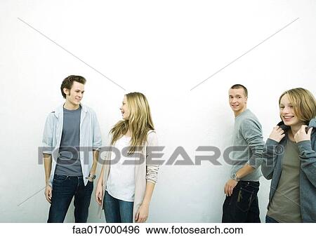 Young male and female friends, white background View Large Photo Image Stock Photograph - Young male and female friends, white background. Fotosearch
