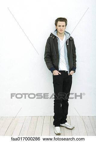 Stock Photograph - Young man, full length portrait. Fotosearch