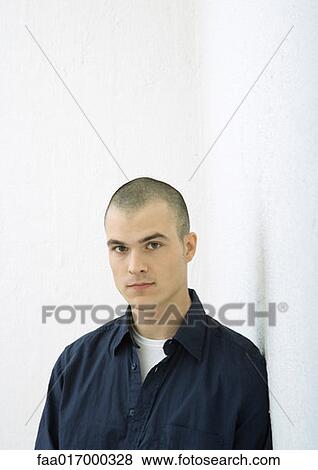 Young man, looking at camera, portrait View Large Photo Image Stock Photo - Young man, looking at camera, portrait. Fotosearch
