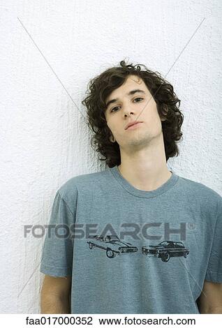 Young man, portrait, white background View Large Photo Image Stock Image - Young man, portrait, white background. Fotosearch