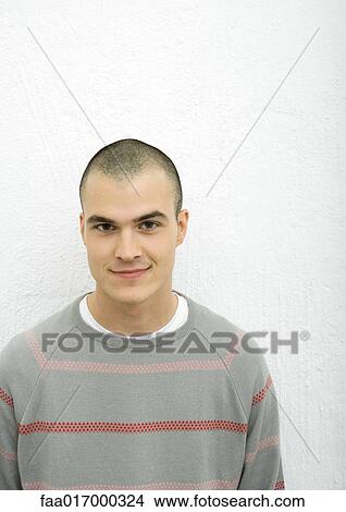 Young man, smiling at camera, portrait View Large Photo Image Picture - Young man, smiling at camera, portrait. Fotosearch