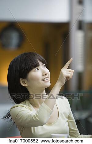 Young woman pointing View Large Photo Image Stock Image - Young woman pointing. Fotosearch