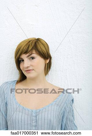 Young woman, portrait, white background View Large Photo Image Stock Image - Young woman, portrait, white background. Fotosearch