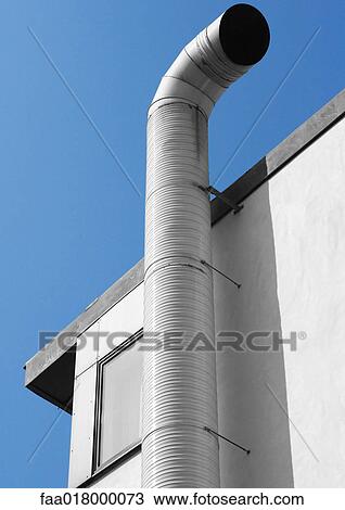 Stock Image - Air duct on top of building. Fotosearch