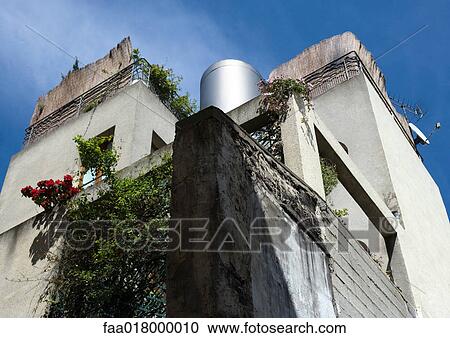 Apartment building with vegetation, low angle view View Large Photo Image Stock Image - Apartment building with vegetation, low angle view. Fotosearch