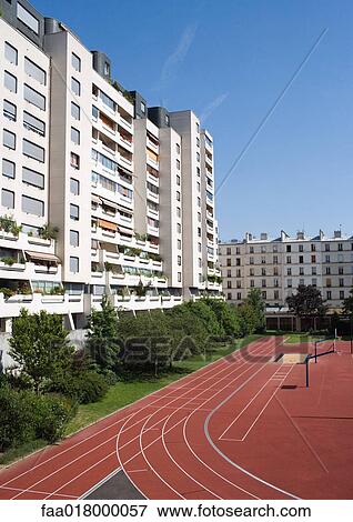 Stock Photo - Apartment complex and running track. Fotosearch