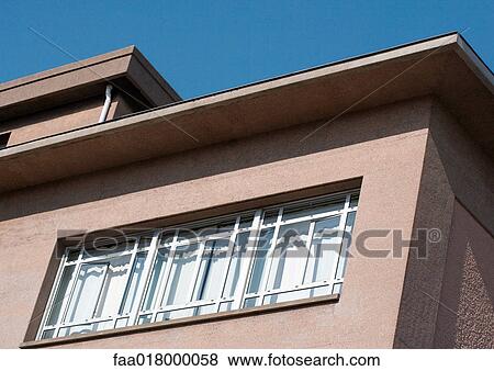 Stock Photo - Apartment with curtains closed, low angle view. Fotosearch