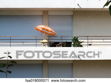 Stock Image - Balcony on modern apartment building. Fotosearch