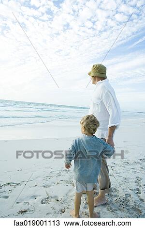 Boy and grandfather on beach View Large Photo Image Stock Image - Boy and grandfather on beach. Fotosearch