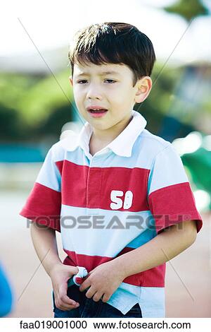 Boy crying on playground View Large Photo Image Stock Image - Boy crying on playground. Fotosearch