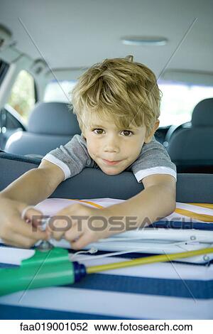 Stock Image - Boy in back of car. Fotosearch