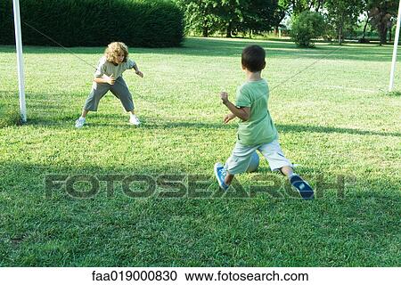 Boys playing soccer View Large Photo Image Stock Image - Boys playing soccer. Fotosearch