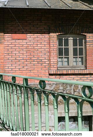 Stock Image - Brick building and railing. Fotosearch