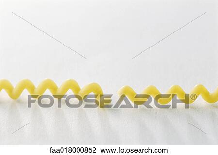 Broken fusilli bucati lunghi noodle View Large Photo Image Stock Image - Broken fusilli bucati lunghi noodle. Fotosearch