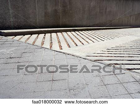 Stock Image - Cement driveway with two different patterns. Fotosearch