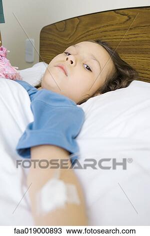 Child lying in hospital bed View Large Photo Image Stock Image - Child lying in hospital bed. Fotosearch