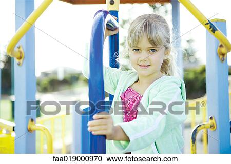 Child on playground equipment View Large Photo Image Stock Image - Child on playground equipment. Fotosearch