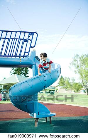 Stock Image - Child on playground equipment. Fotosearch